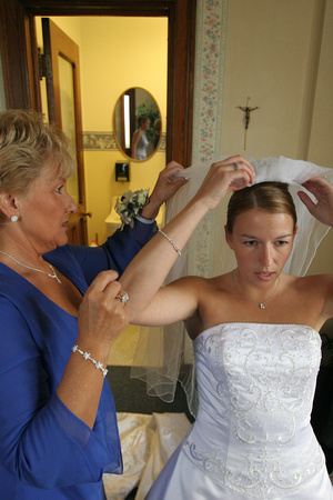adjusting bride's veil