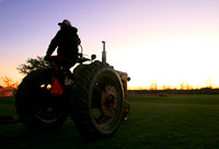 Tractor farmer sunset