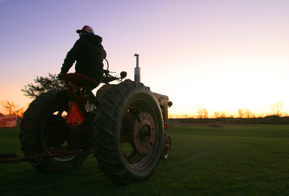 Tractor farmer sunset