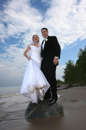 Bride & groom on the beach shore